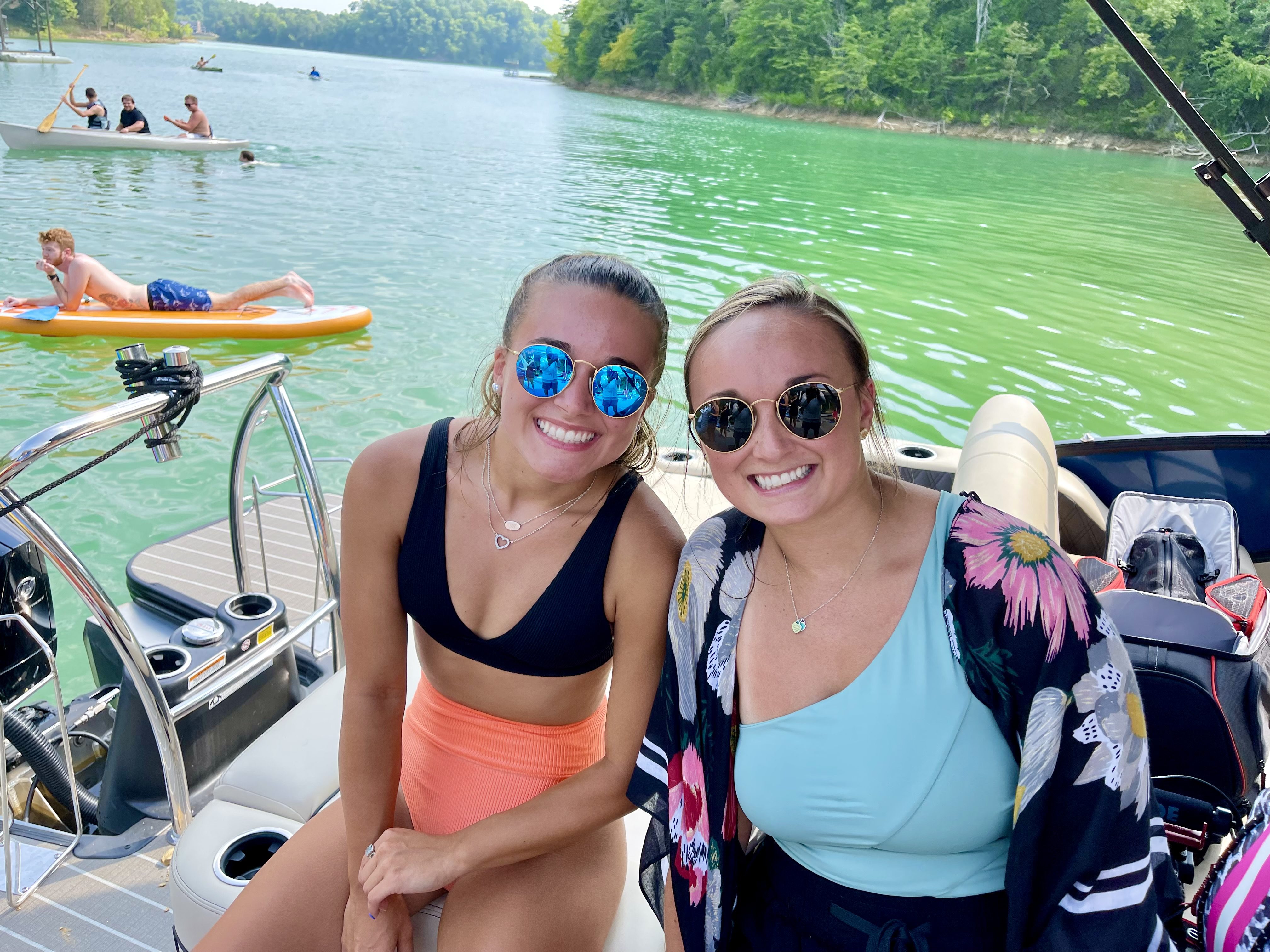 two college students on lake trip for college ministry